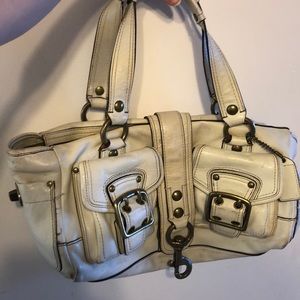 Coach handbag. Cream in color with brass hardware.